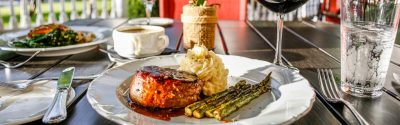 Plate of steak, mashed potatoes, asparagus, and red wine